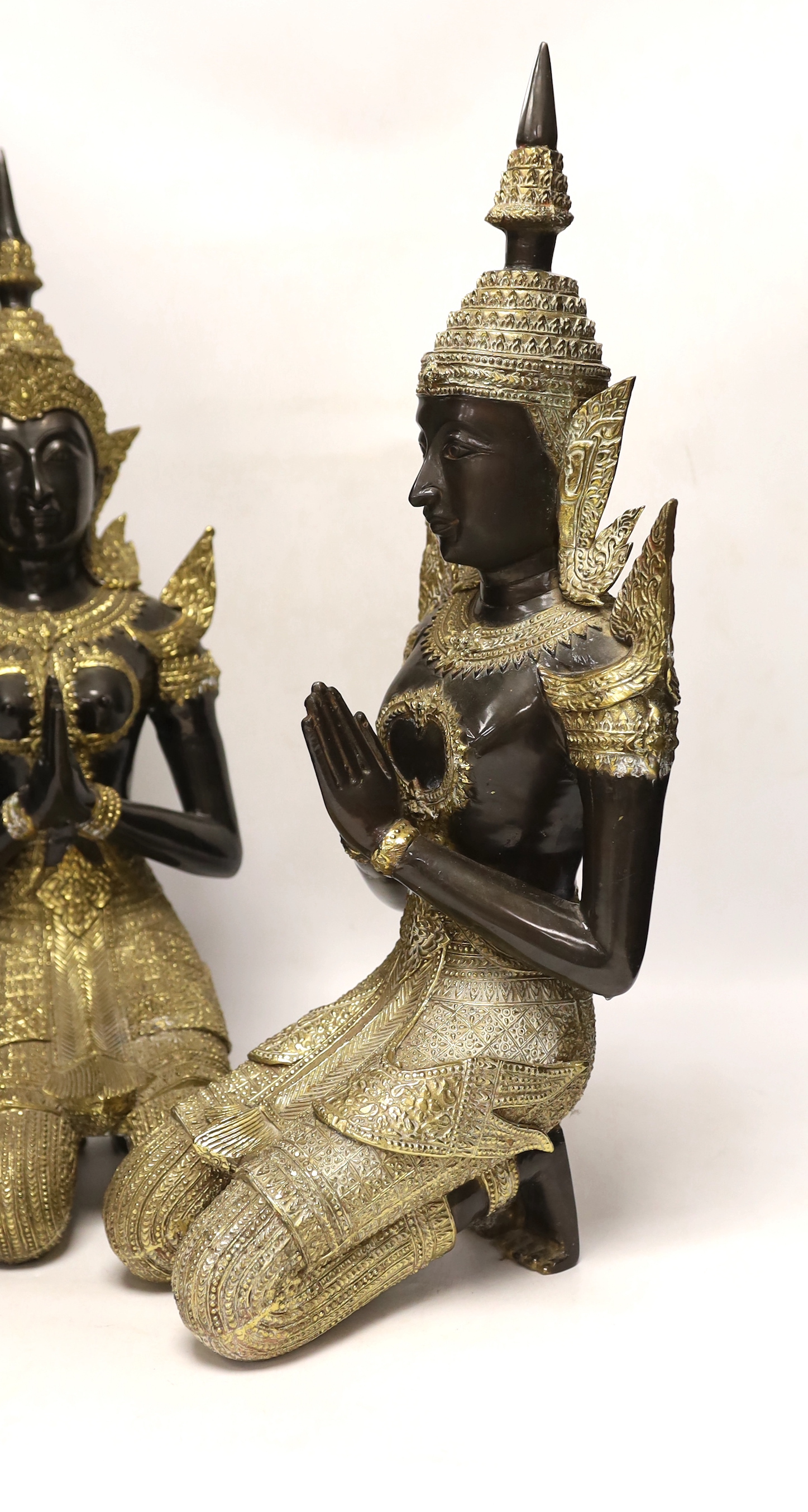 Two 20th century gilt decorated metal models of 'Thai Buddhas', 54 cm high